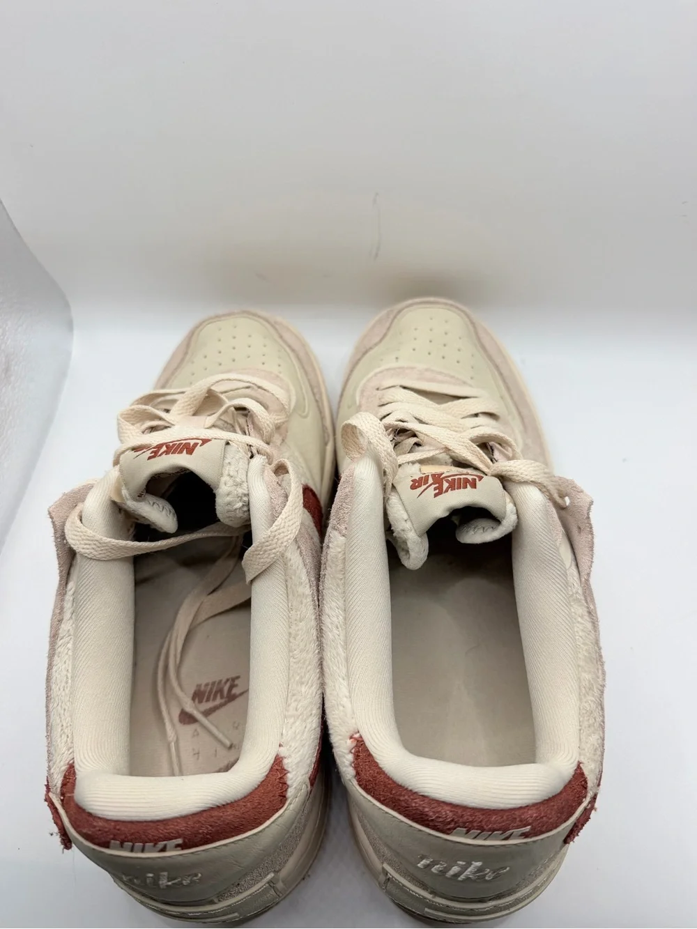 Nike Women's Low-Top Sneakers in Cream with Rust Swoosh